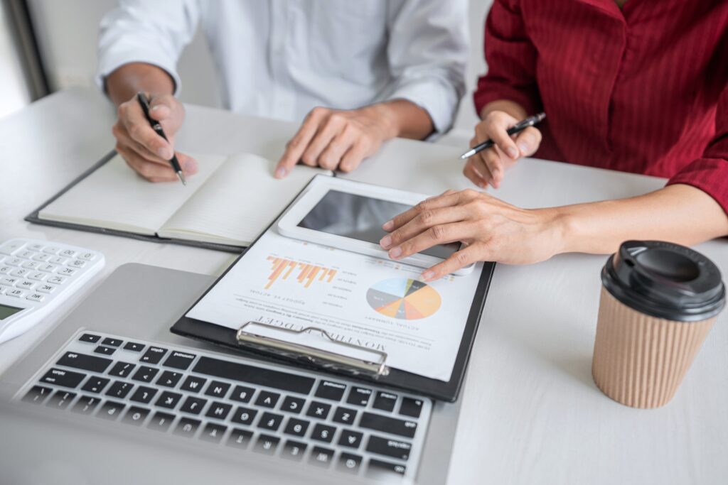 Teamwork of business consultation new strategy plan business and market growth on financial document